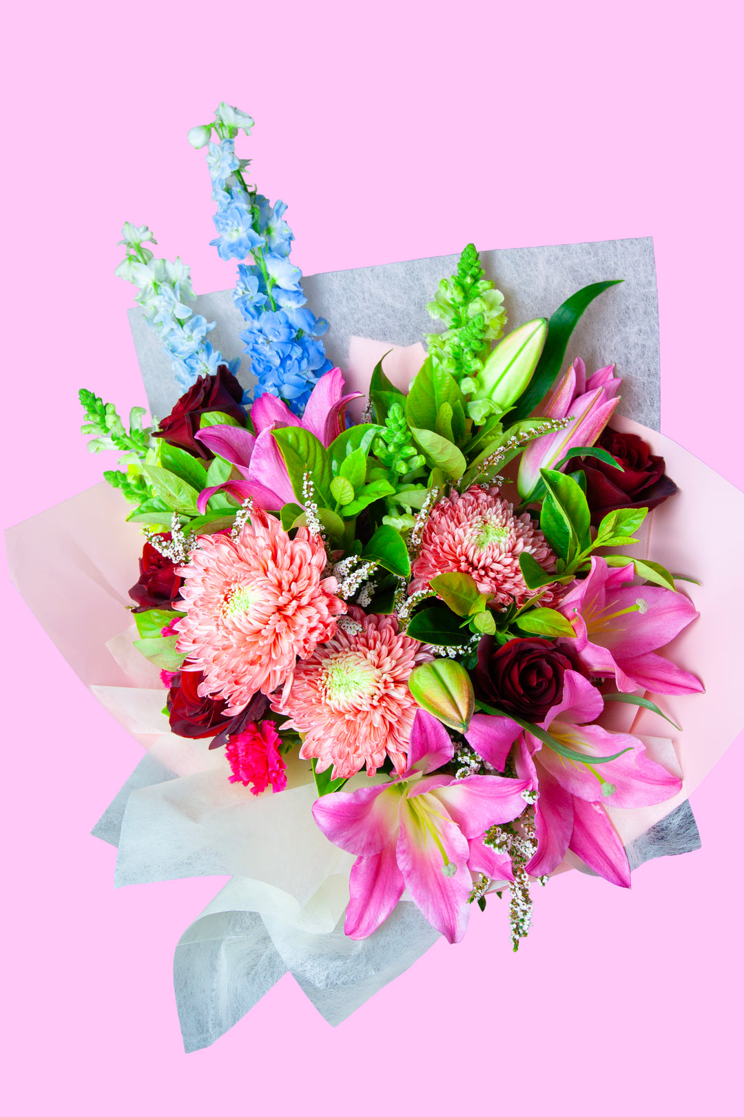 Cranberry Kiss vibrant pink and red flower bouquet featuring red roses and pink lilies by The Flori Shoppe Melbourne