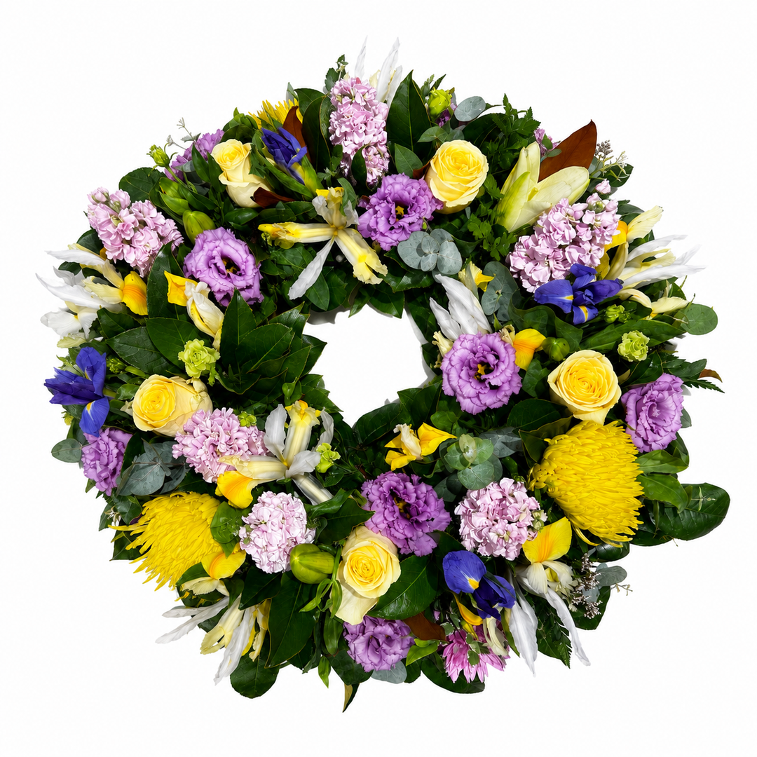  Lavender &amp; Gold Celebration Wreath, featuring elegant iris, yellow roses, purple lisianthus and fresh seasonal flowers. 