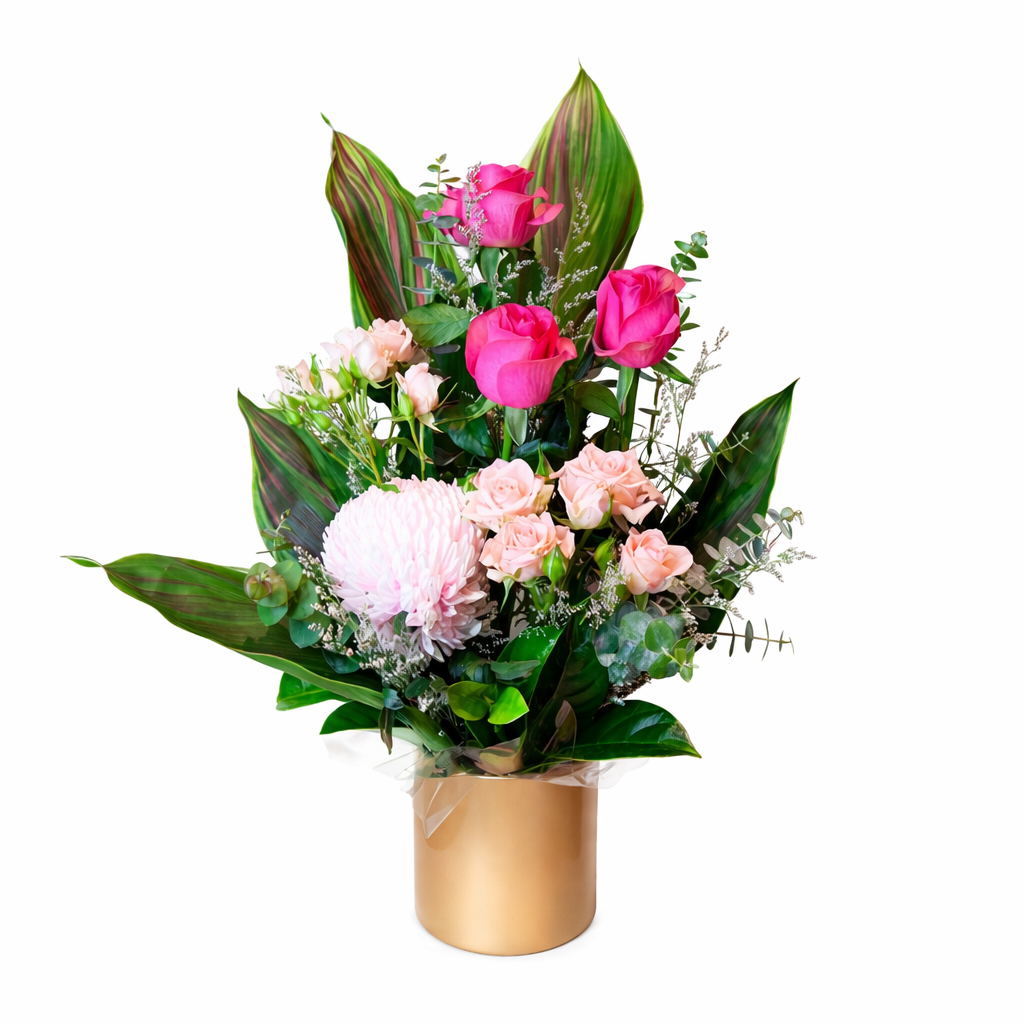 Bouquet of flowers in a gold pot on a white background