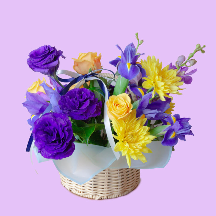 Golden Lavender Basket
Purple & Yellow Flower Basket
A vibrant flower basket featuring elegant purple blooms, golden yellow roses and chrysanthemums, beautifully arranged with fresh seasonal flowers to celebrate life's special moments with warmth, joy and elegance.