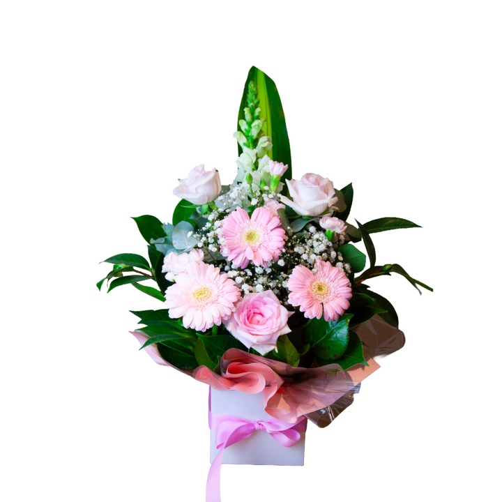 Sweet Blossom Box arrangement featuring fresh pink gerberas, soft roses, and green foliage in a signature gift box by The Flori Shoppe Melbourne.