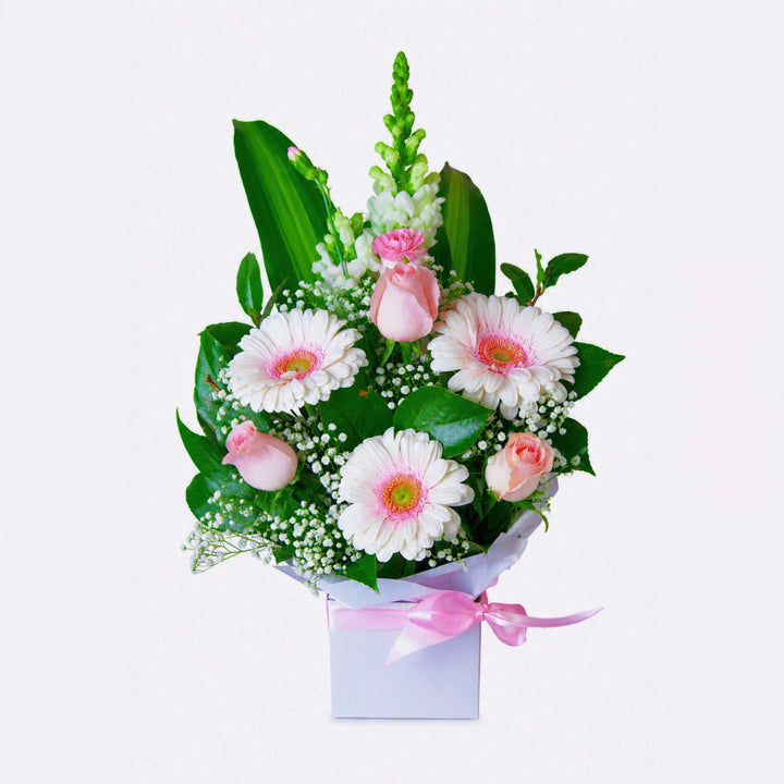 Sweet Blossom Box arrangement featuring fresh pink gerberas, soft roses, and green foliage in a signature gift box by The Flori Shoppe Melbourne.
