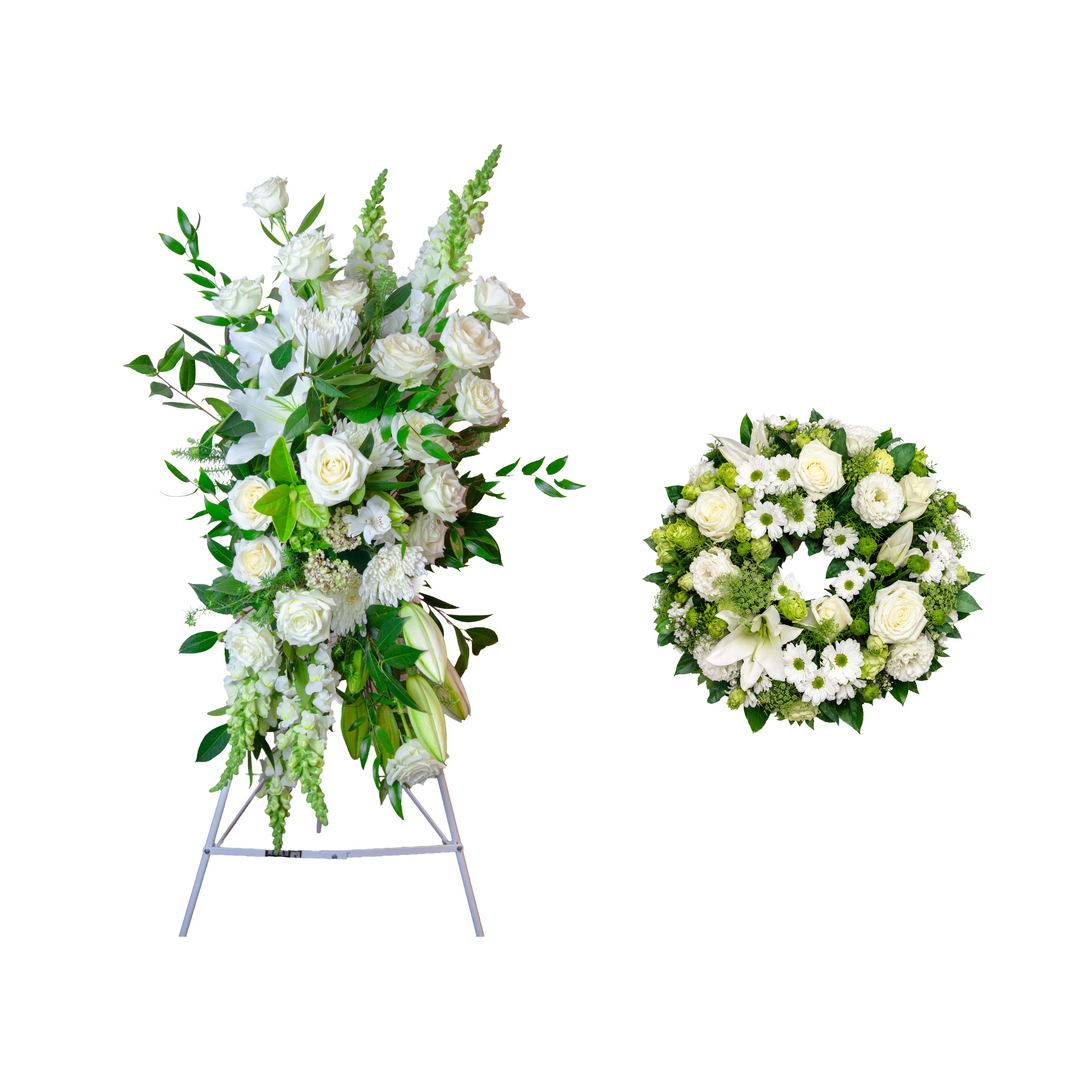 Evergreen Grace Funeral Wreath and Classic White Standing Spray package displayed together as an elegant white funeral flower tribute.