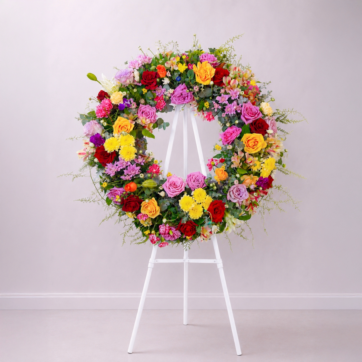 Circle of Remembrance premium rose funeral wreath featuring fresh seasonal roses, chrysanthemums and fine fern foliage by The Flori Shoppe Melbourne.