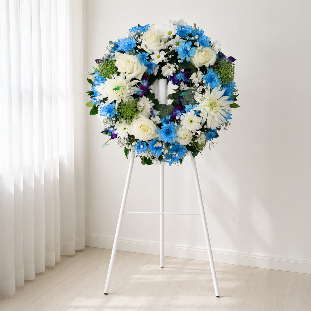 Baby Blue Tribute modern blue and white funeral wreath with roses, chrysanthemums and orchids Melbourne