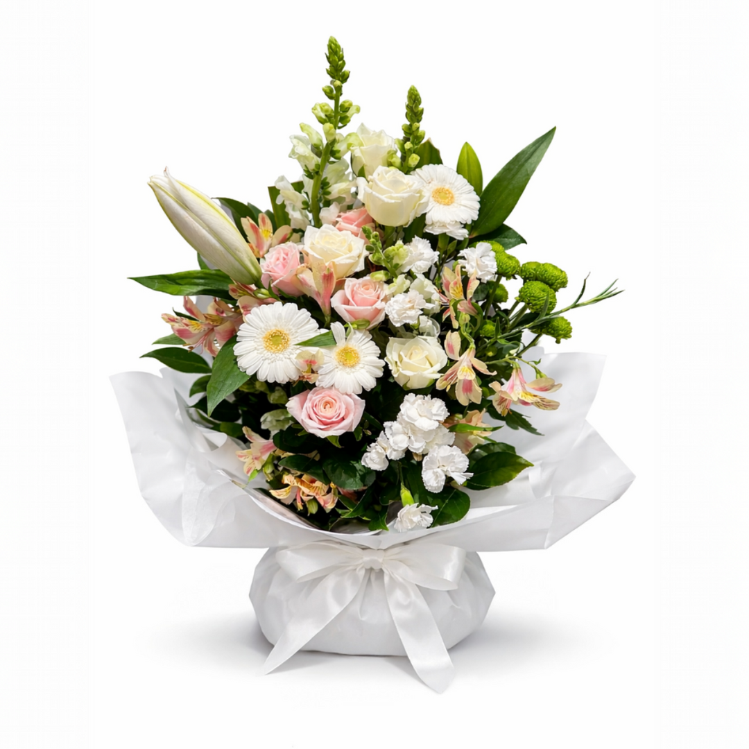 Delicately arranged in a natural garden style, our Blush Whisper Garden Arrangement features a harmonious blend of soft pink roses, creamy white blooms and fresh seasonal greenery.
