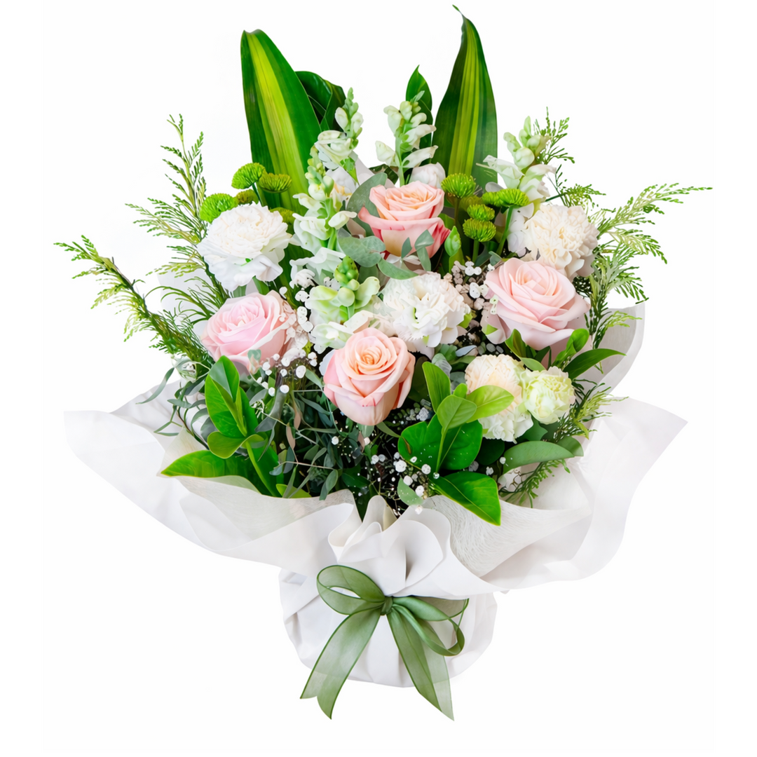 Arrangement of pink and white roses with greenery on a white background