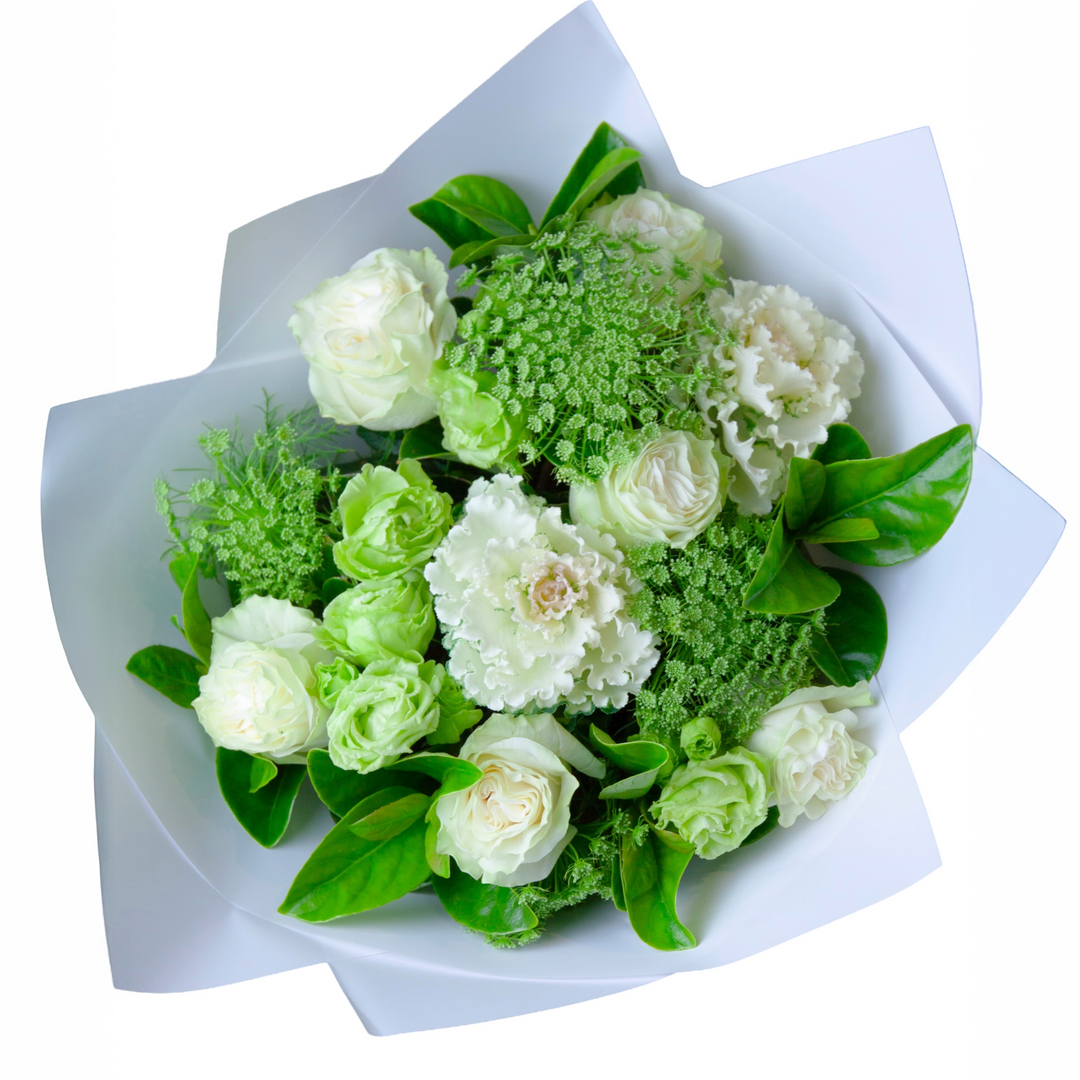 Snow Garden white garden bouquet featuring premium white roses, lisianthus, seasonal ornamental kale and fresh greenery, beautifully wrapped for gifting.