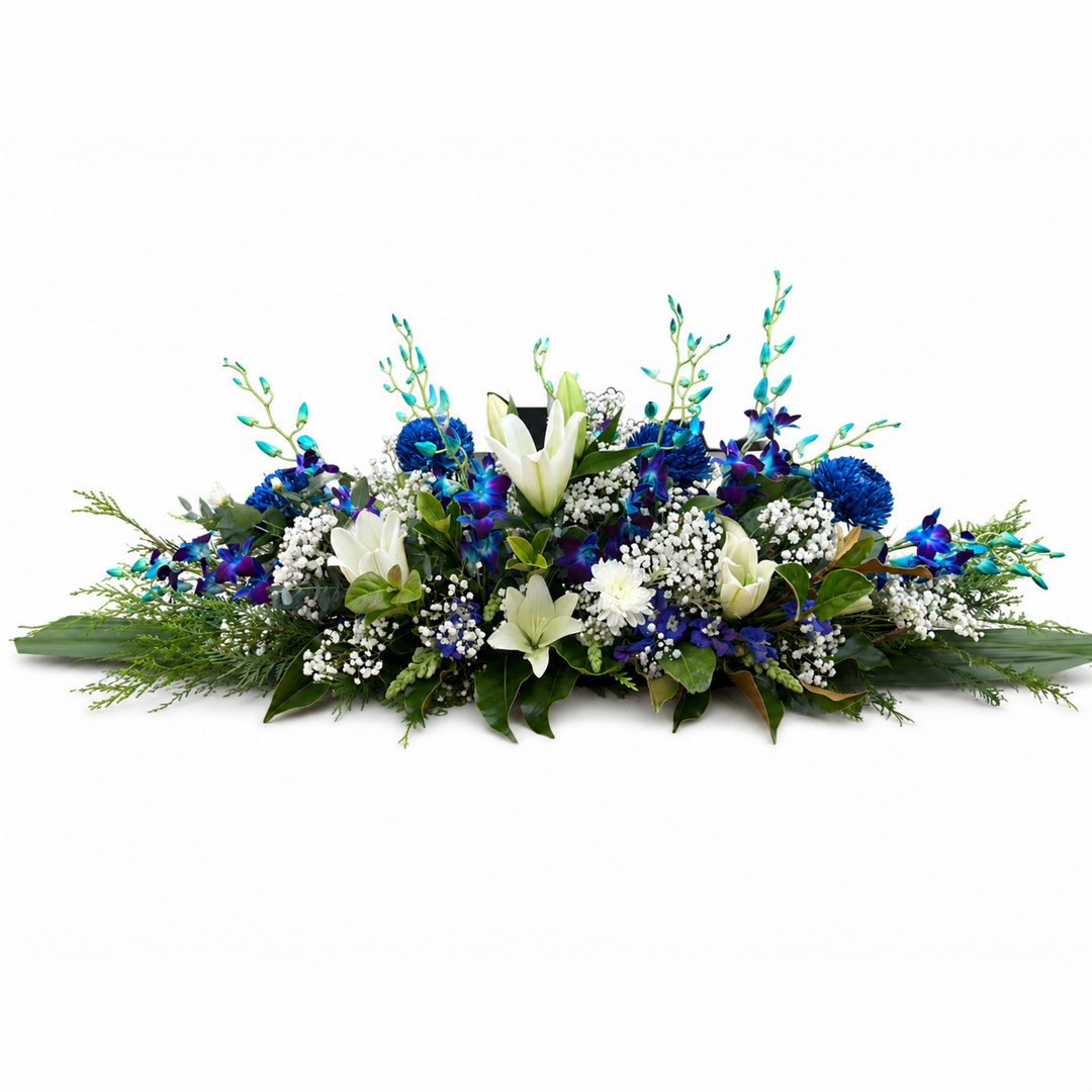 Azure Serenity luxury blue and white funeral casket spray featuring blue orchids and white lilies Melbourne