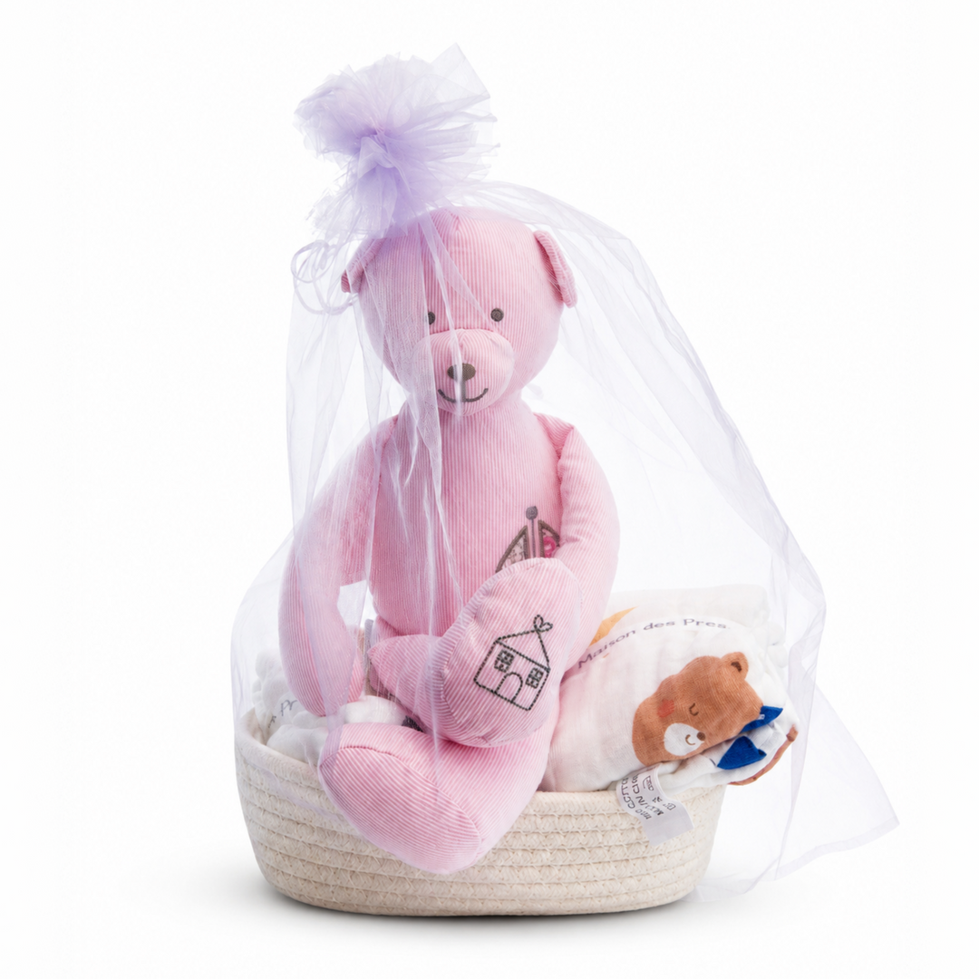 Cherie Bebe Hamper featuring Manon des Pres muslin blanket and pink plush teddy bear in a soft woven basket