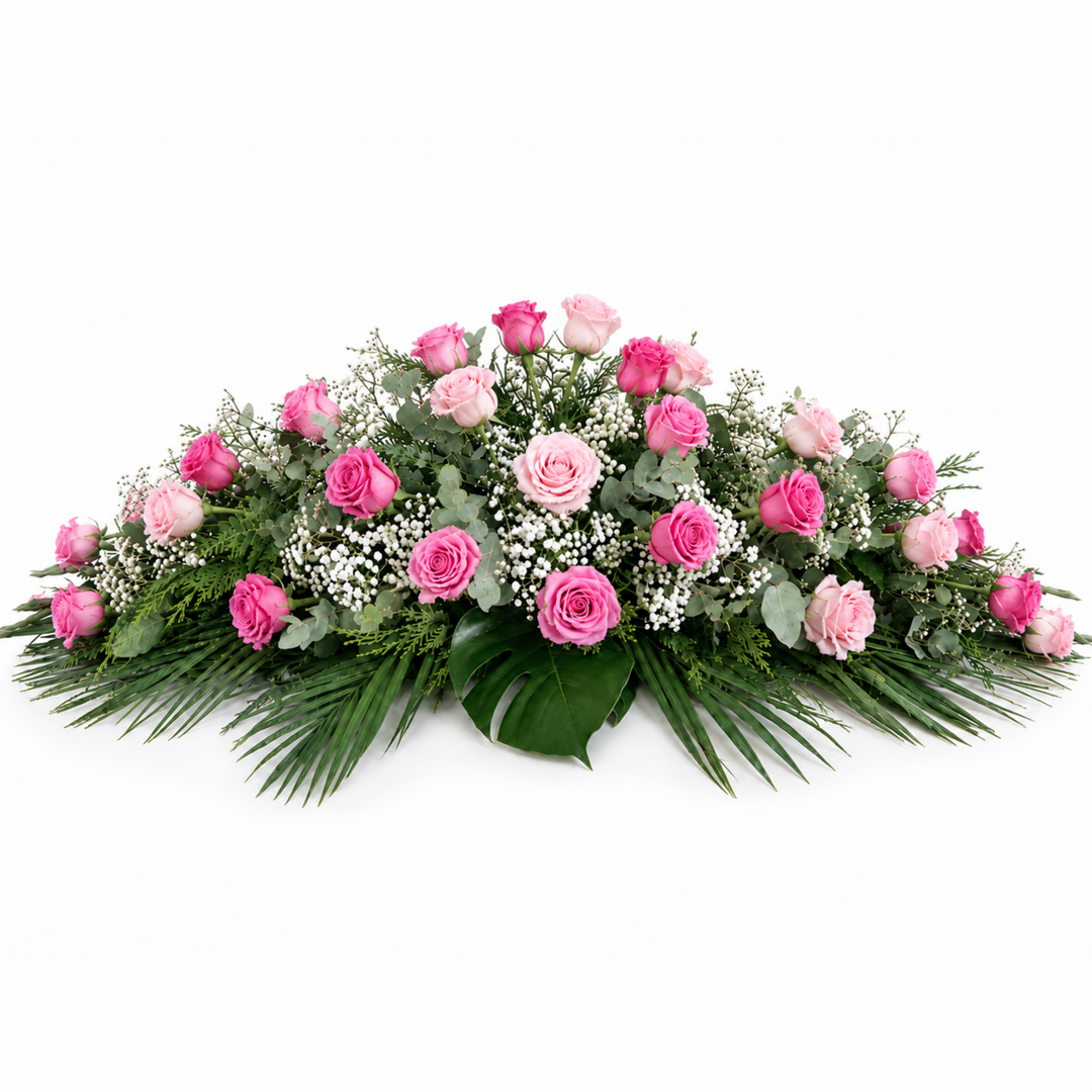 Classic funeral casket spray made entirely of premium pink roses and lush foliage for Melbourne funeral services