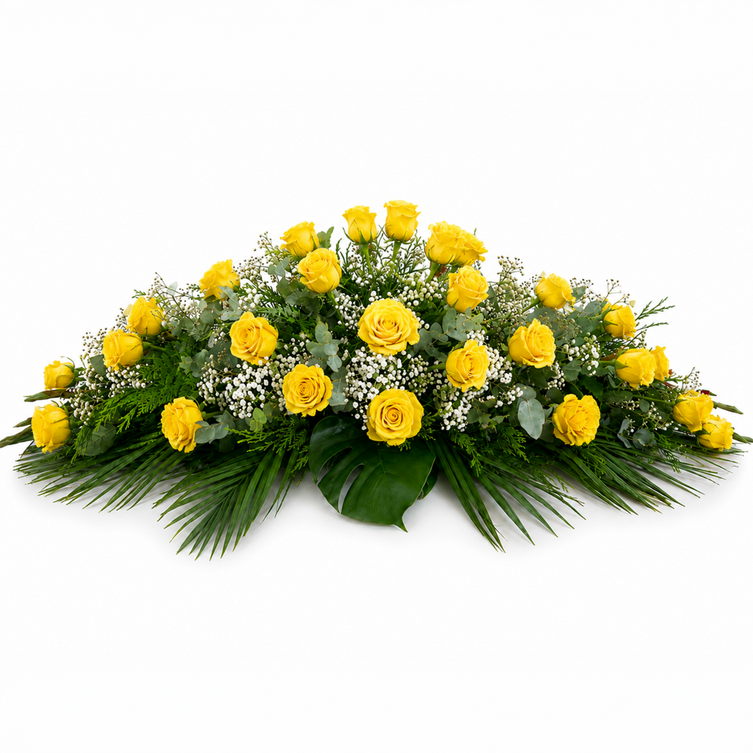 Classic funeral casket spray made entirely of premium yellow roses and lush foliage for Melbourne funeral service