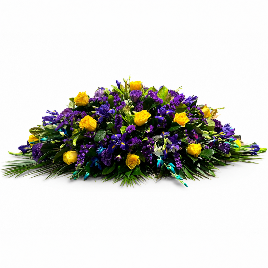 a Pastorale yellow rose and purple funeral casket spray handcrafted in Melbourne