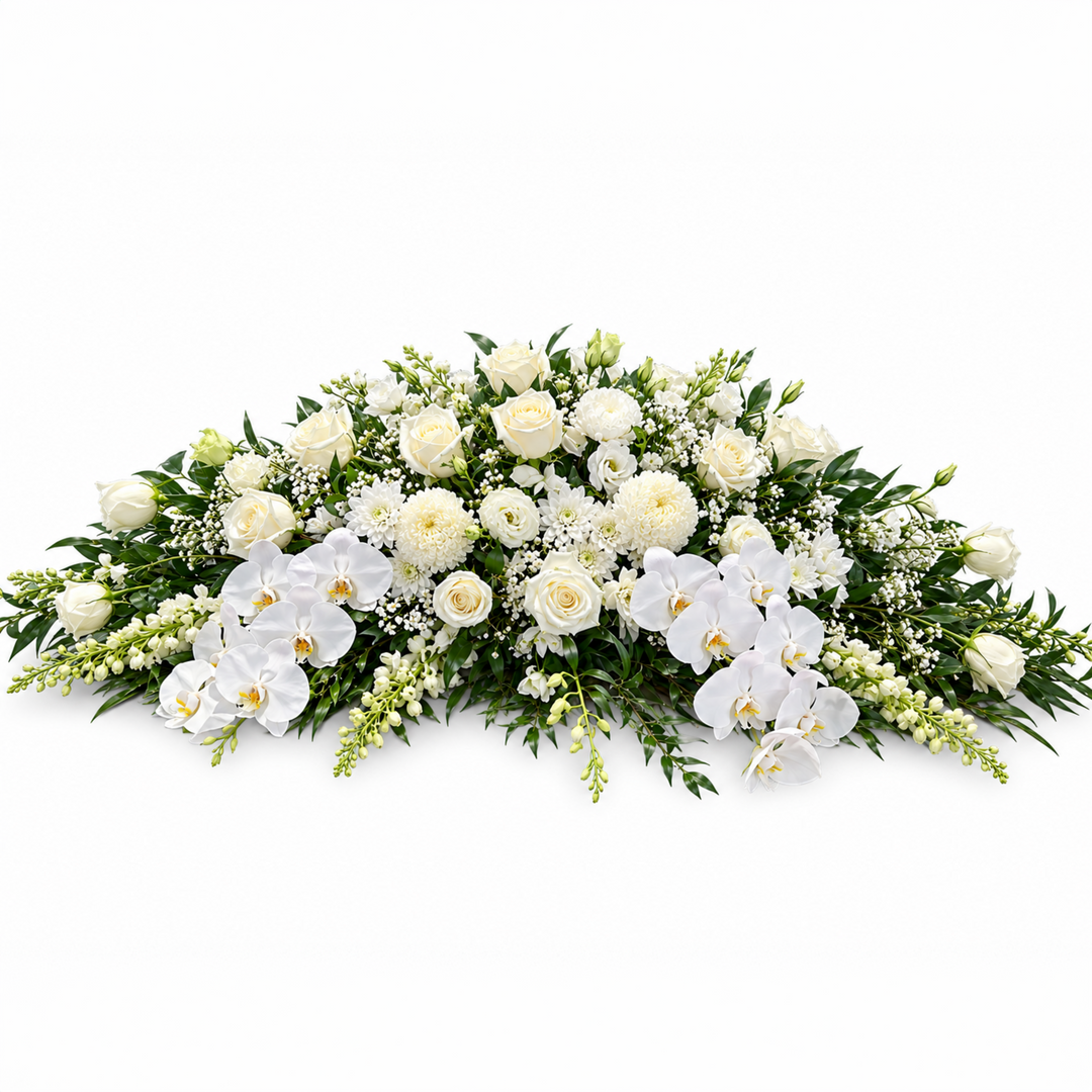 Luxury white Phalaenopsis orchid casket spray with white roses, lilies, and lush greenery for funeral service in Melbourne