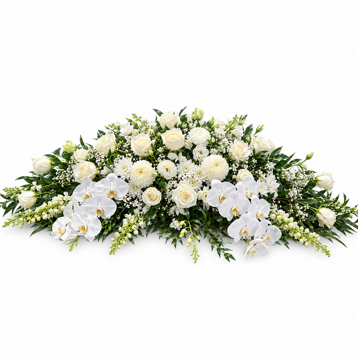 Luxury white Phalaenopsis orchid casket spray with white roses, lilies, and lush greenery for funeral service in Melbourne