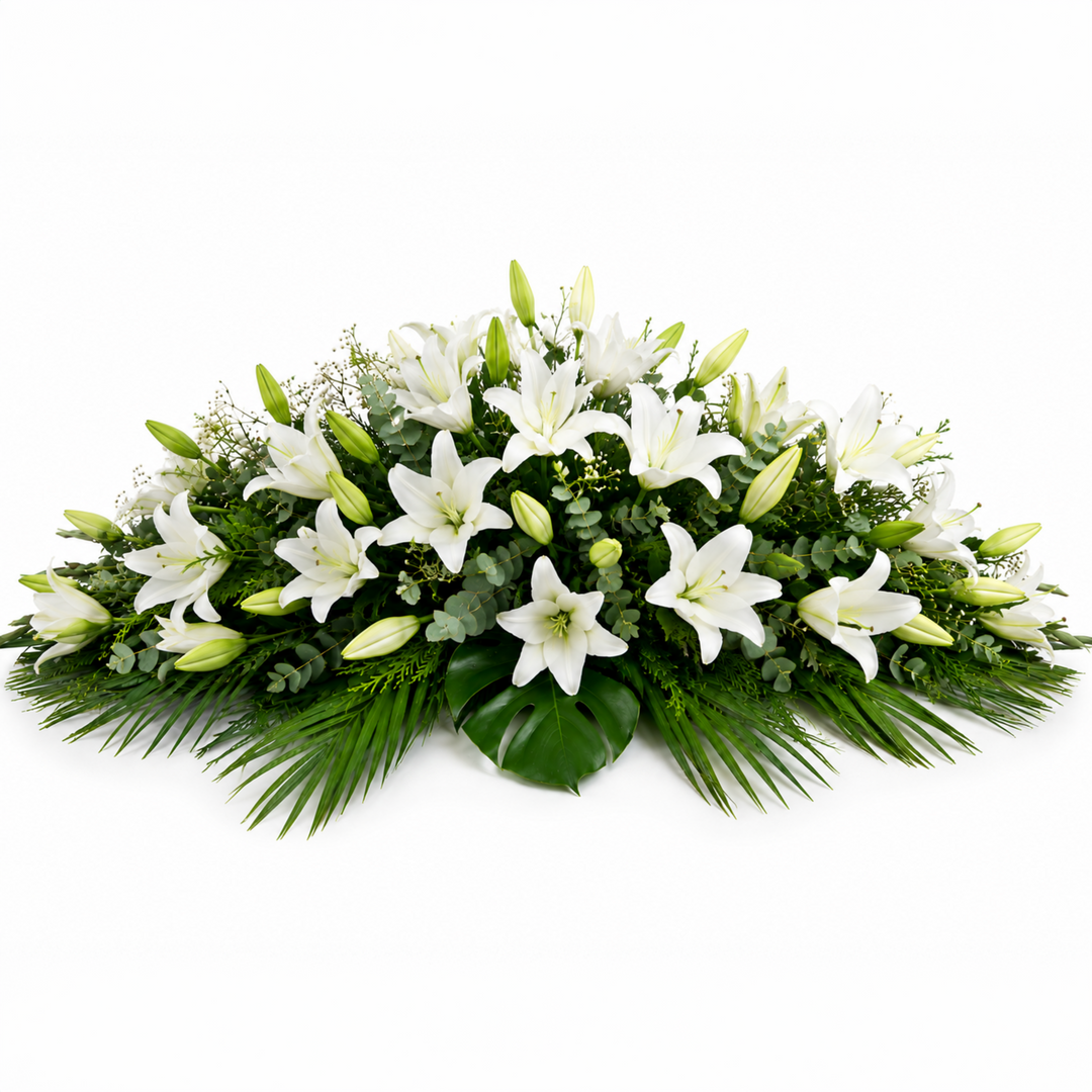 Majestic funeral casket spray crafted entirely with premium white Oriental Lilies and lush foliage for Melbourne funeral services