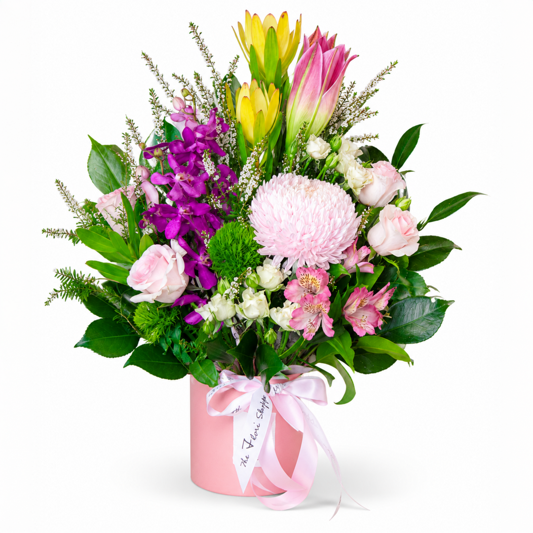 Pink Elegance handcrafted mixed pink flower box arrangement featuring roses, orchids, lilies, and disbud chrysanthemum by The Flori Shoppe Melbourne.