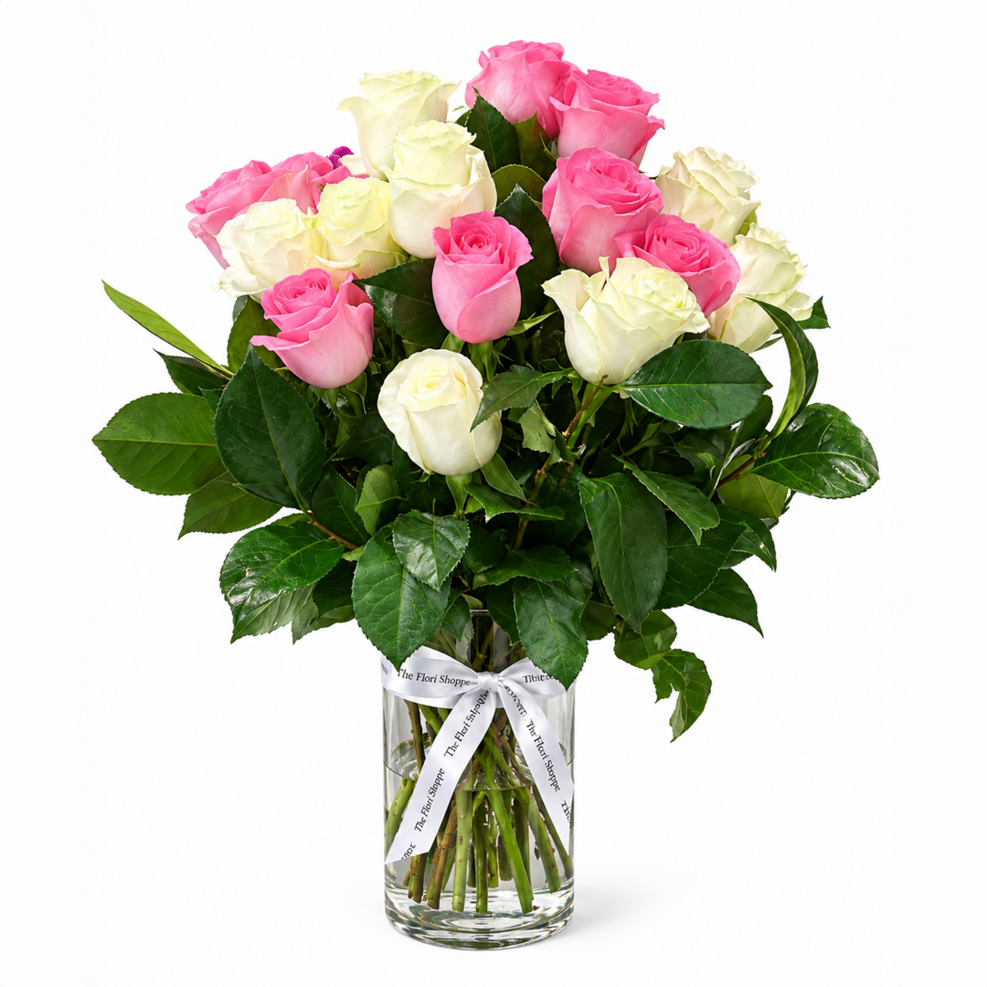 Handcrafted blush pink and pure white rose arrangement in a clear glass vase by The Flori Shoppe Melbourne.