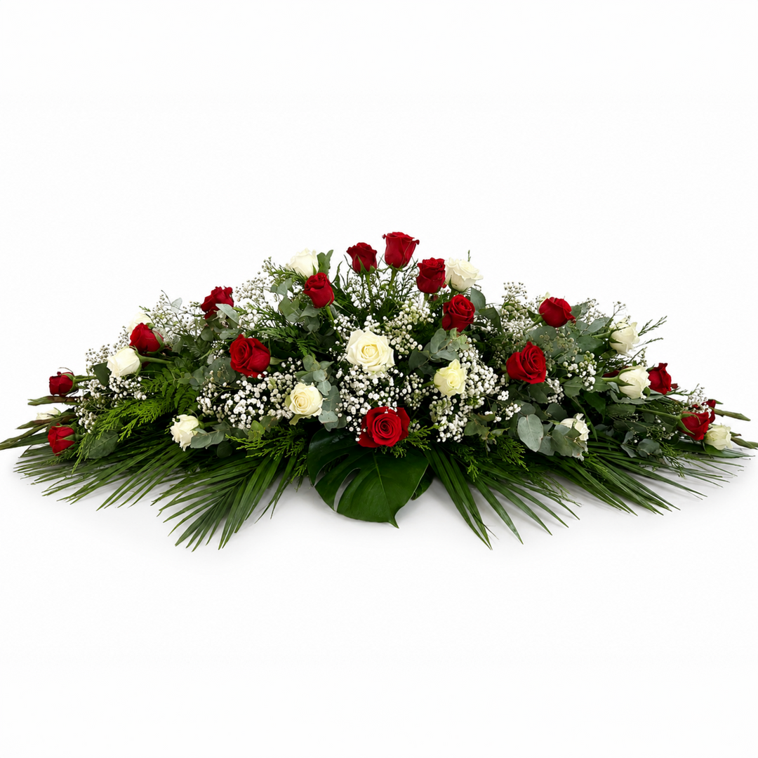 Red and White Grace classic funeral casket spray featuring red roses, white roses, baby's breath and lush foliage in Melbourne