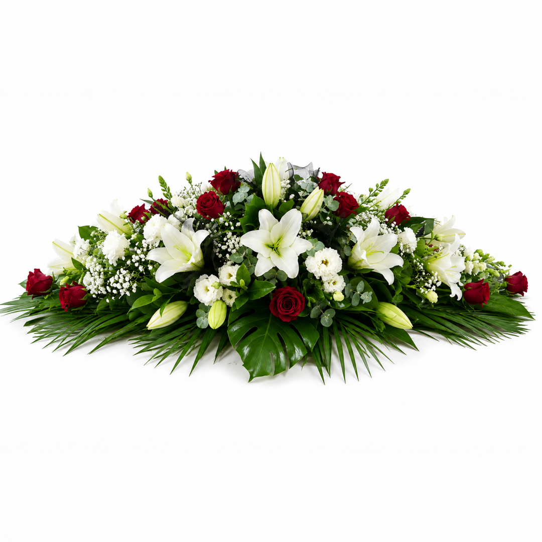 Red Rose and White Lily Elegance casket spray featuring red roses, white lilies, white lisianthus and green foliage in Melbourne