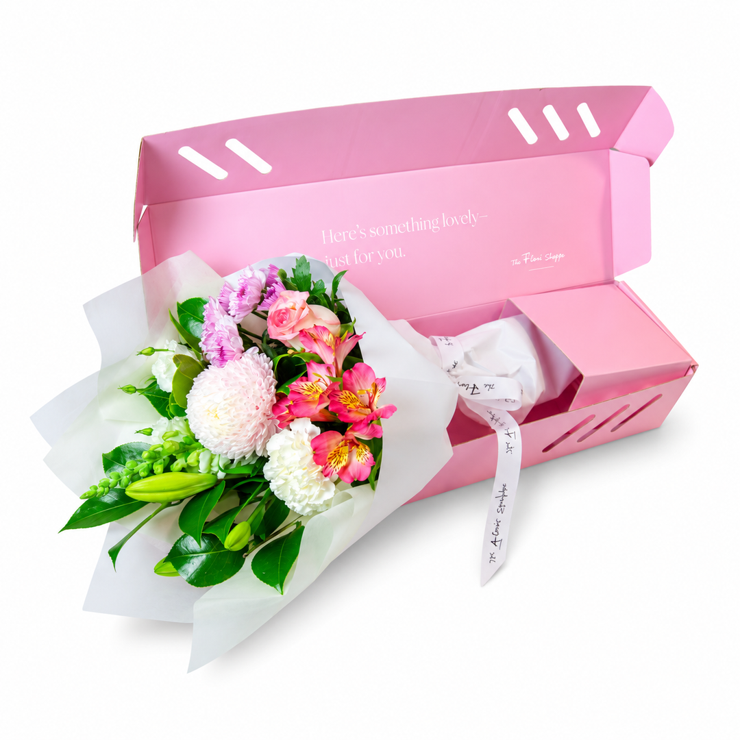 The Flori Box Blush featuring a fresh seasonal petite bouquet nestled inside a signature pink gift box by The Flori Shoppe 