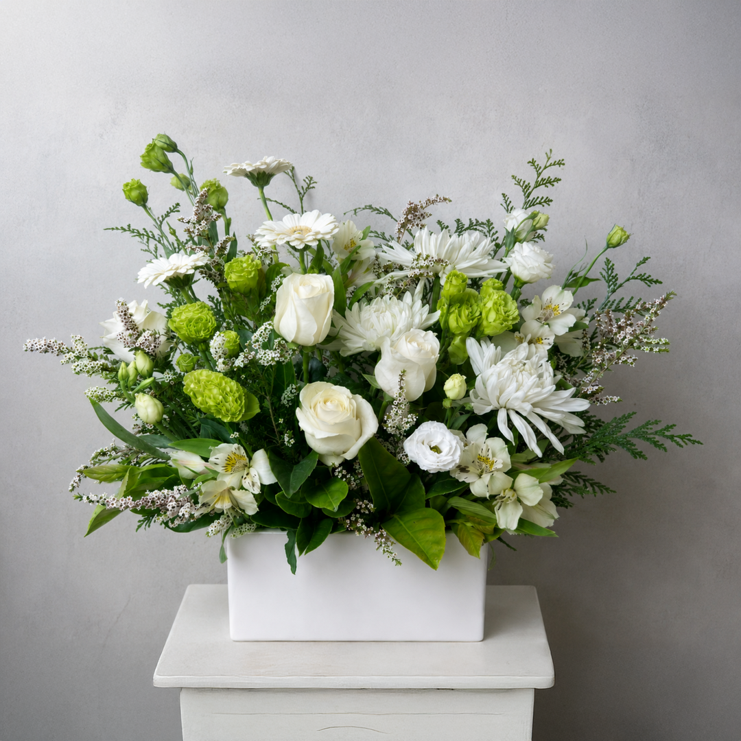 White Beauty white and green flower arrangement featuring white roses, chrysanthemums, lisianthus and lush greenery